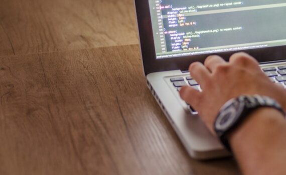 A man on a computer looking into IT solutions