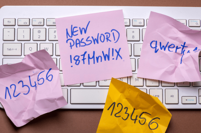 A keyboard covered with bad passwords showing someone who has not used 5 password tips to keep their SME safe.