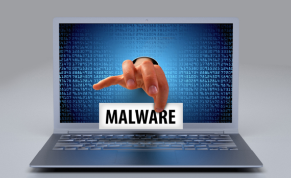 A laptop with a person reaching their hand through a laptop screen showing how people need to protect their SMEs against malware